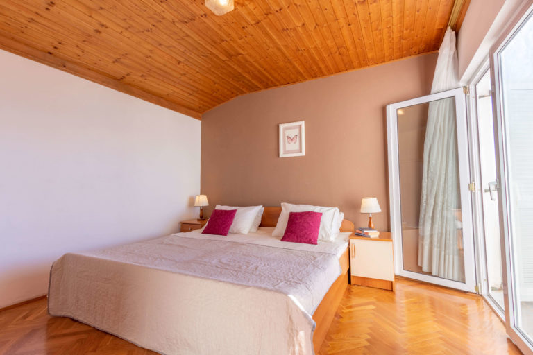 Sleeping room with balcony and closet